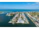 Waterfront homes line canals with ocean access, featuring private docks and beautiful coastal living at 624 N Point Dr, Holmes Beach, FL 34217