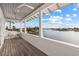 Inviting balcony with scenic water views, comfortable seating, and a ceiling fan for added comfort at 624 N Point Dr, Holmes Beach, FL 34217