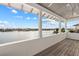 Inviting balcony with scenic water views, a wood ceiling, and bright exterior paint at 624 N Point Dr, Holmes Beach, FL 34217