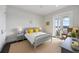 Bedroom with neutral colors, ceiling fan, and access to a small balcony at 624 N Point Dr, Holmes Beach, FL 34217
