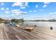 Fun dock area with chairs and cornhole, a great place for relaxation and fun at 624 N Point Dr, Holmes Beach, FL 34217