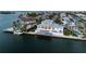 Beautiful waterfront property featuring a pool, private boat dock, and spacious outdoor entertaining area at 624 N Point Dr, Holmes Beach, FL 34217
