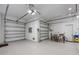 Spacious garage with epoxy flooring, ample storage, and room for multiple vehicles and bikes at 624 N Point Dr, Holmes Beach, FL 34217