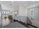 Hallway with dark hardwood floors and decorated with mirrors and art at 624 N Point Dr, Holmes Beach, FL 34217