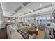 Bright, open-concept living area with water views and stylish furnishings at 624 N Point Dr, Holmes Beach, FL 34217