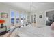 Bright main bedroom with water view, and access to private patio through sliding glass doors at 624 N Point Dr, Holmes Beach, FL 34217