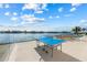 Outdoor patio features a ping pong table and views of the harbor at 624 N Point Dr, Holmes Beach, FL 34217