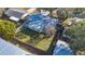 Overhead view showcasing the home's spacious yard, fencing, and surrounding neighborhood at 7272 Cass Cir, Sarasota, FL 34231