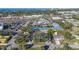Aerial view of a residential property near commercial establishments and open water at 7272 Cass Cir, Sarasota, FL 34231