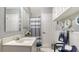 Cozy bathroom with white cabinets, modern fixtures, and bright lighting at 7272 Cass Cir, Sarasota, FL 34231