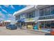 Commercial building with various shops and businesses, displaying a vibrant street view at 7272 Cass Cir, Sarasota, FL 34231