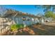 Well-maintained single-story home with a fenced yard and concrete driveway at 7272 Cass Cir, Sarasota, FL 34231