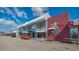 Commercial structure with brick and mural elements, reflecting a unique and inviting atmosphere at 7272 Cass Cir, Sarasota, FL 34231