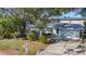 Well-maintained single-story home with landscaped front yard and attached garage at 7272 Cass Cir, Sarasota, FL 34231