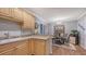 Partial view of a kitchen, with a dining table and chairs in the background at 7272 Cass Cir, Sarasota, FL 34231