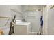 This well-equipped laundry room features shelving and a washer and dryer at 7272 Cass Cir, Sarasota, FL 34231