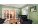 Comfortable living room with view of dining room through a glass-paneled sliding door at 7272 Cass Cir, Sarasota, FL 34231