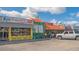 Charming ice cream and Italian ice shop with colorful storefront and outdoor seating at 7272 Cass Cir, Sarasota, FL 34231