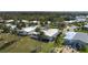 Aerial view of residences nestled amidst lush landscaping and serene lakes, highlighting the tranquil community at 8449 Imperial Cir, Palmetto, FL 34221