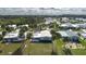 Aerial view of property showcasing meticulous landscaping and lakeside community at 8449 Imperial Cir, Palmetto, FL 34221