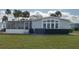 Charming home with well-kept lawn and a screened-in porch, offering peaceful outdoor living at 8449 Imperial Cir, Palmetto, FL 34221