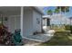 Exterior side view of home showcases meticulous landscaping, and a glimpse of the screened-in porch at 8449 Imperial Cir, Palmetto, FL 34221