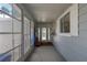Cozy sun room with tiled floor and large windows offering abundant natural light and outdoor views at 8449 Imperial Cir, Palmetto, FL 34221