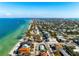 Aerial view of the home near beautiful beaches, turquoise waters and a vibrant coastal community at 912 N Shore Dr, Anna Maria, FL 34216