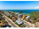 An aerial shot showing the home in relation to the community and the beautiful beaches at 912 N Shore Dr, Anna Maria, FL 34216
