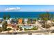 An aerial showcases the home's great location to the beach, neighborhood, and a peek at the gazebo at 912 N Shore Dr, Anna Maria, FL 34216