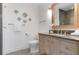 Charming bathroom features decorative fish accents, a modern vanity, and stylish patterned tile flooring at 912 N Shore Dr, Anna Maria, FL 34216