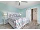 The bedroom features stylish flooring, coastal decor and access to an en-suite bathroom with decorative floor tiles at 912 N Shore Dr, Anna Maria, FL 34216