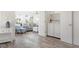 Bright entryway with wood-look floors and white walls with laundry area access at 912 N Shore Dr, Anna Maria, FL 34216