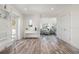 Bright entryway with wood-look floors and white walls with entry to the home at 912 N Shore Dr, Anna Maria, FL 34216