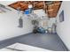 The garage includes overhead storage and well-kept epoxy flooring with room for your vehicles and storage needs at 912 N Shore Dr, Anna Maria, FL 34216
