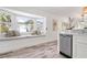 Charming kitchen nook with window seating and stainless steel dishwasher at 912 N Shore Dr, Anna Maria, FL 34216