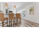 Kitchen bar featuring wicker seating and modern pendant lighting at 912 N Shore Dr, Anna Maria, FL 34216