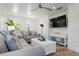 Bright living room featuring comfortable seating, white shiplap walls, and modern decor at 912 N Shore Dr, Anna Maria, FL 34216