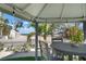 Inviting outdoor seating area featuring a charming gazebo with views of the beach and the ocean beyond at 912 N Shore Dr, Anna Maria, FL 34216