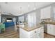 Stylish kitchen island flows into a sunlit living space at 11330 80Th E St, Parrish, FL 34219