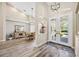 Bright foyer with high ceilings and natural light, adjacent to dining area and living spaces at 1314 Brambling Ct, Bradenton, FL 34212