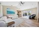 Open living area with a view of the pool, stylish furnishings, and wood-look flooring at 1314 Brambling Ct, Bradenton, FL 34212