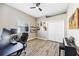 Office space featuring wood-look floors, neutral walls, ceiling fan, and natural light at 1314 Brambling Ct, Bradenton, FL 34212