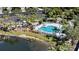 Aerial shot of the pool and playground area in the River Sound community with parking and lake view at 1407 Morning Sky Gln, Bradenton, FL 34208