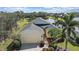 An aerial shot reveals this home's position on a beautiful lot with pond views and mature landscaping at 1407 Morning Sky Gln, Bradenton, FL 34208