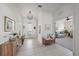 Bright foyer featuring tile flooring, a decorative light fixture, and views into the living area at 1407 Morning Sky Gln, Bradenton, FL 34208