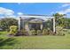 Private patio with seating offers an intimate space to enjoy the outdoors at 1407 Morning Sky Gln, Bradenton, FL 34208