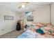 Bedroom featuring a ceiling fan, beach accents, and a pilates machine at 1515 Forrest Nelson Blvd # Q205, Port Charlotte, FL 33952