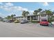 Condo building featuring a well-maintained exterior, landscaping, and convenient parking for residents at 1515 Forrest Nelson Blvd # Q205, Port Charlotte, FL 33952