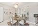 This open dining room features contemporary accents and leads seamlessly into the living area at 1515 Forrest Nelson Blvd # Q205, Port Charlotte, FL 33952